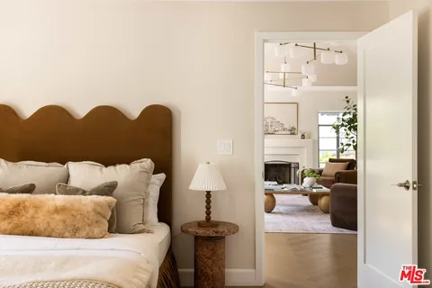 a living room with furniture fireplace and a fireplace