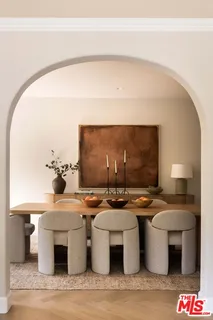 a room with stainless steel appliances kitchen island a stove a faucet and a view of living room