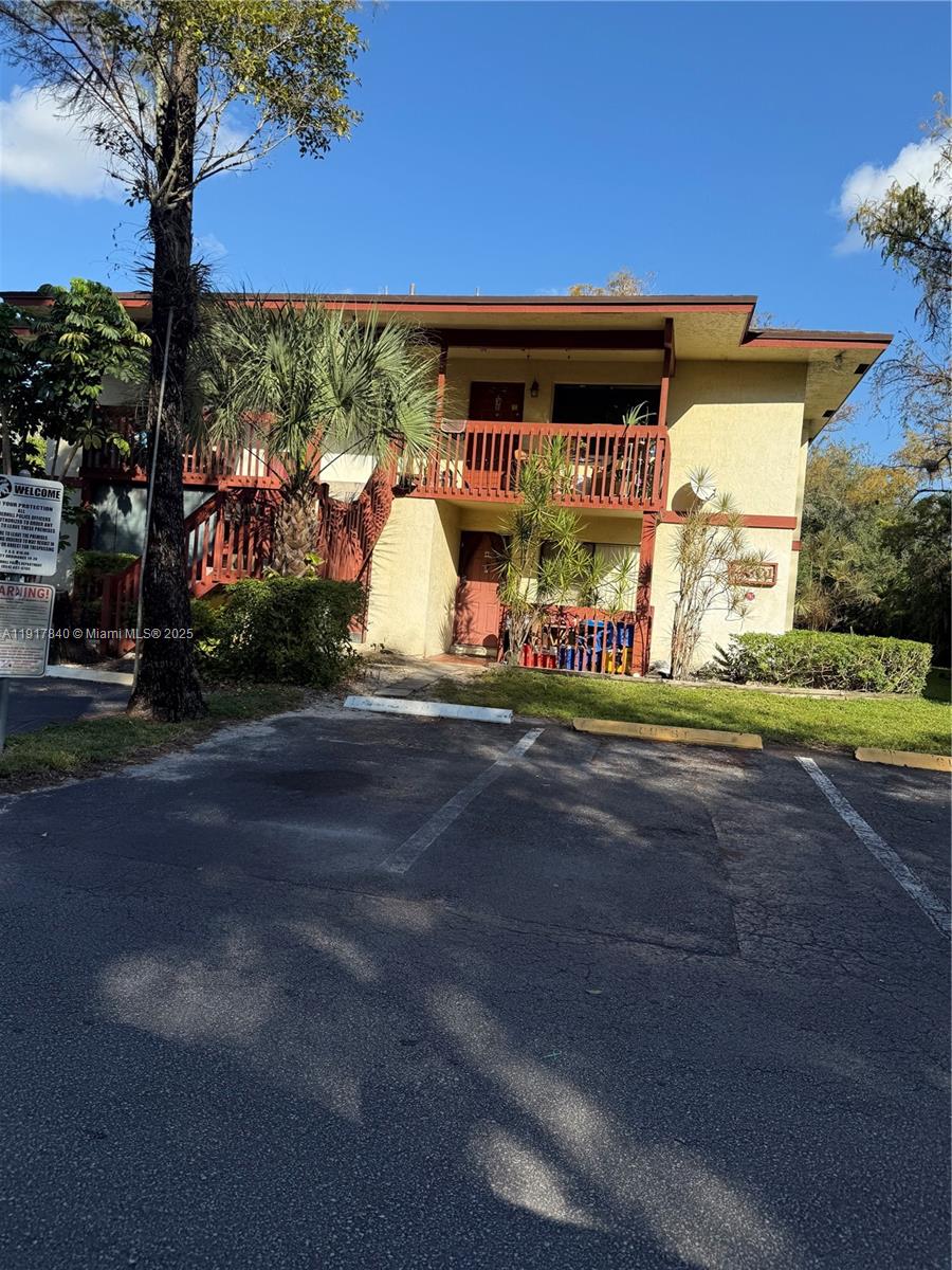 4301 Northwest 19th Street, Unit 7 Lauderhill, FL 33313 - Photo 1 of 12 a sign on the side of a building