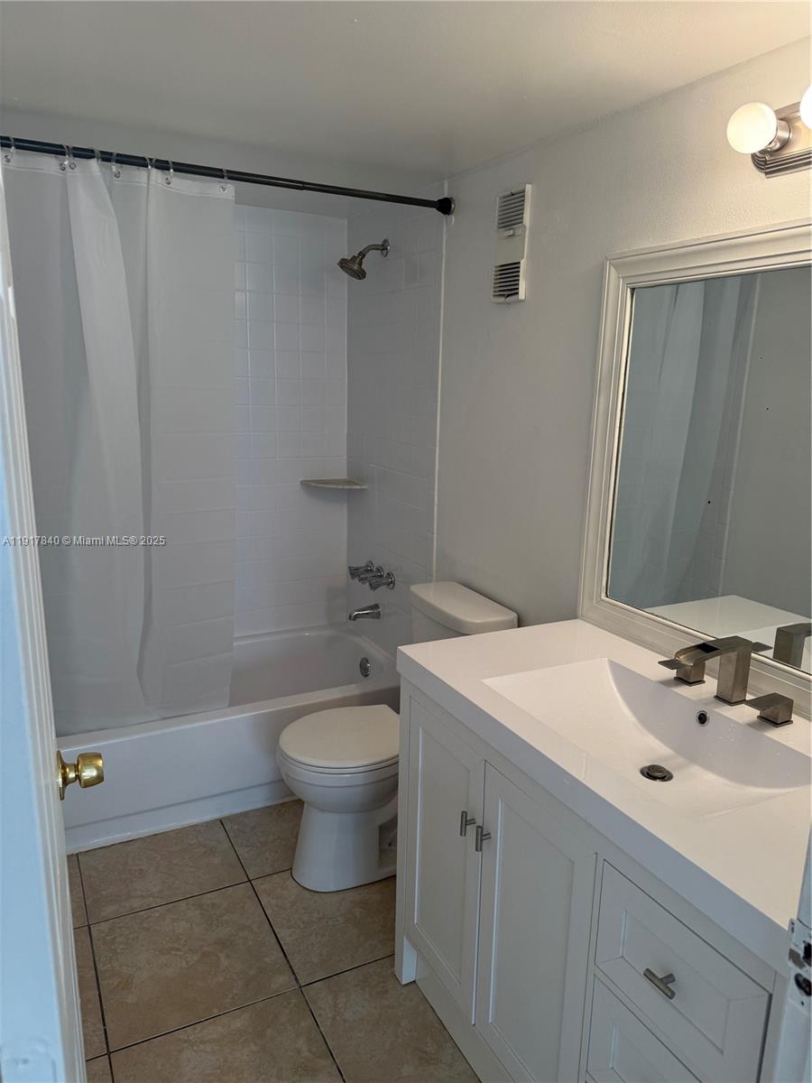 4301 Northwest 19th Street, Unit 7 Lauderhill, FL 33313 - Photo 11 of 12 a bathroom with a sink a toilet and shower