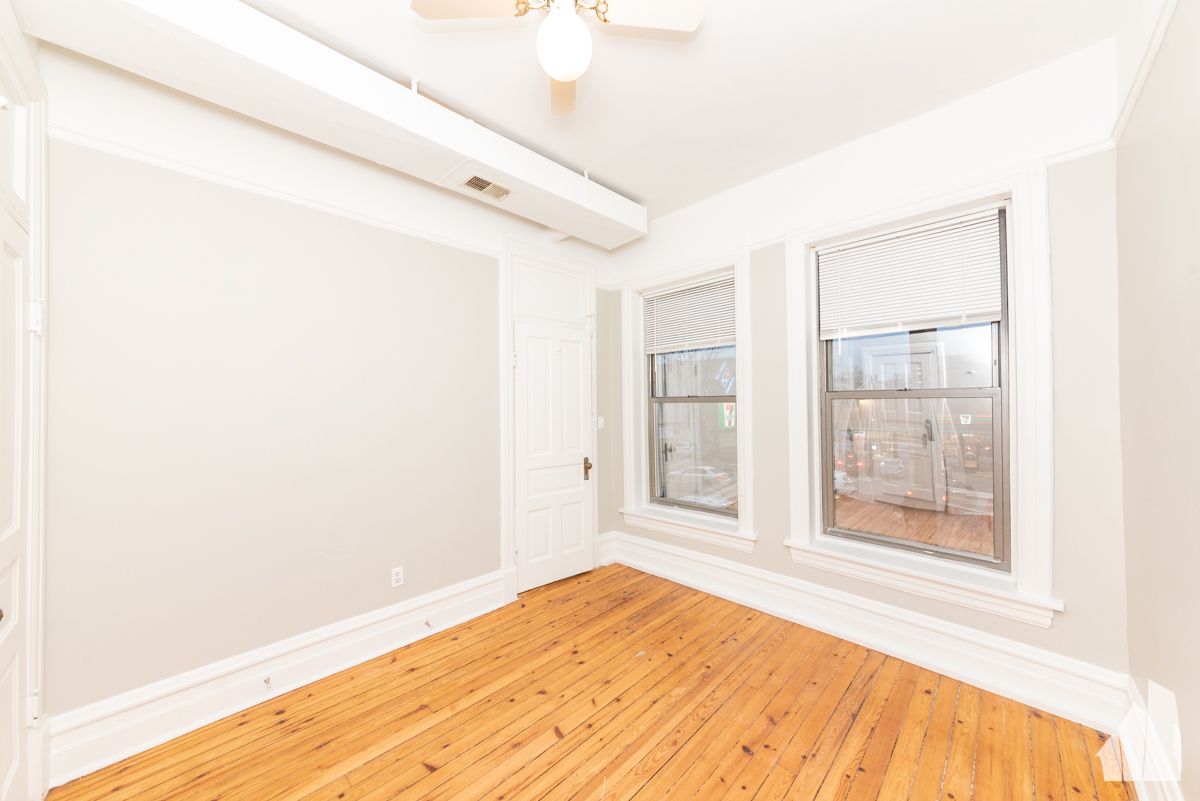 1420 West Irving Park Road, Unit 3 Chicago, IL 60613 - Photo 16 of 21 a view of empty room with wooden floor and fan