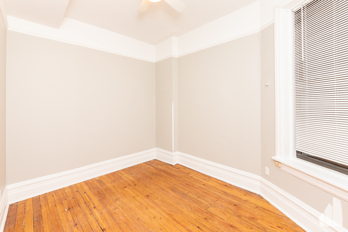1420 West Irving Park Road, Unit 3 Chicago, IL 60613 - Photo 18 of 21 a view of empty room with wooden floor