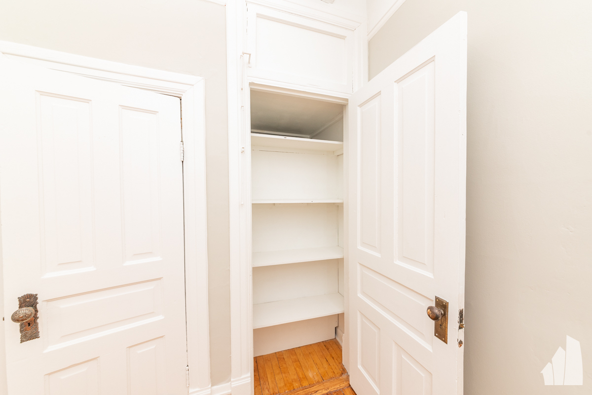 1420 West Irving Park Road, Unit 3 Chicago, IL 60613 - Photo 4 of 21 a view of walk in closet with empty racks