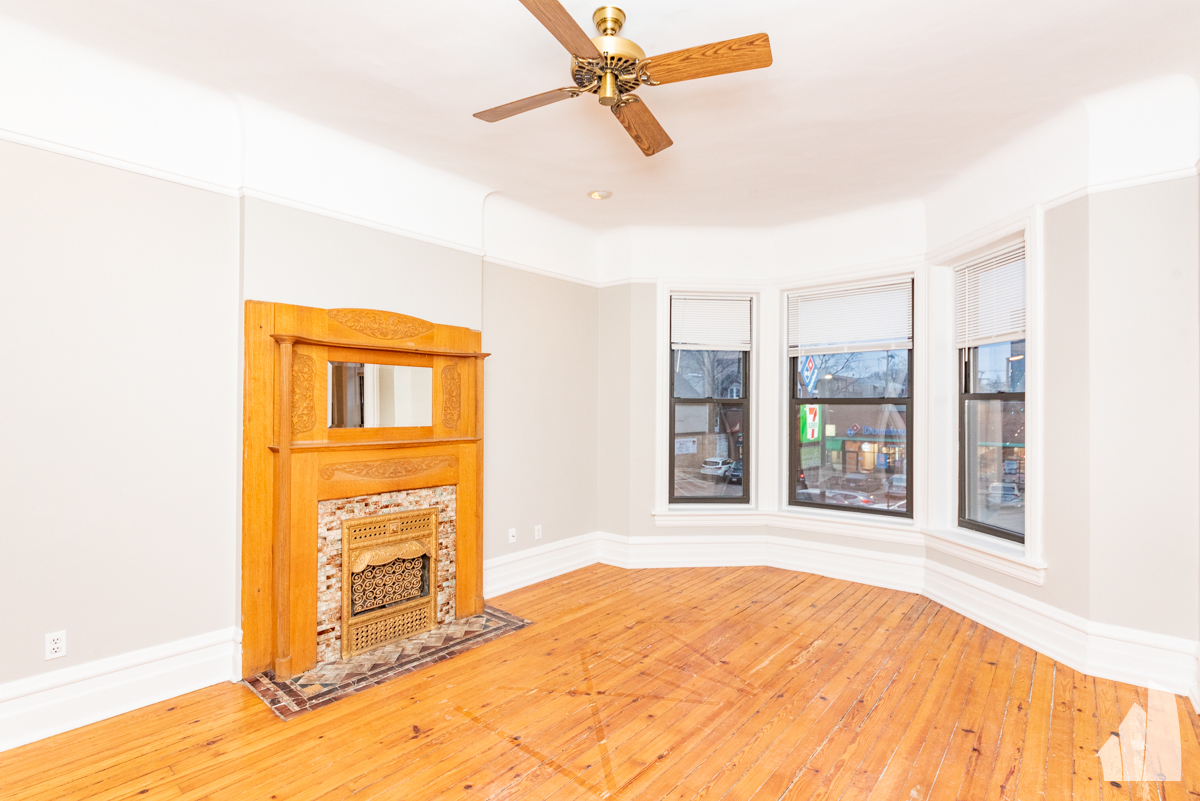 1420 West Irving Park Road, Unit 3 Chicago, IL 60613 - Photo 9 of 21 a view of an empty room with a window
