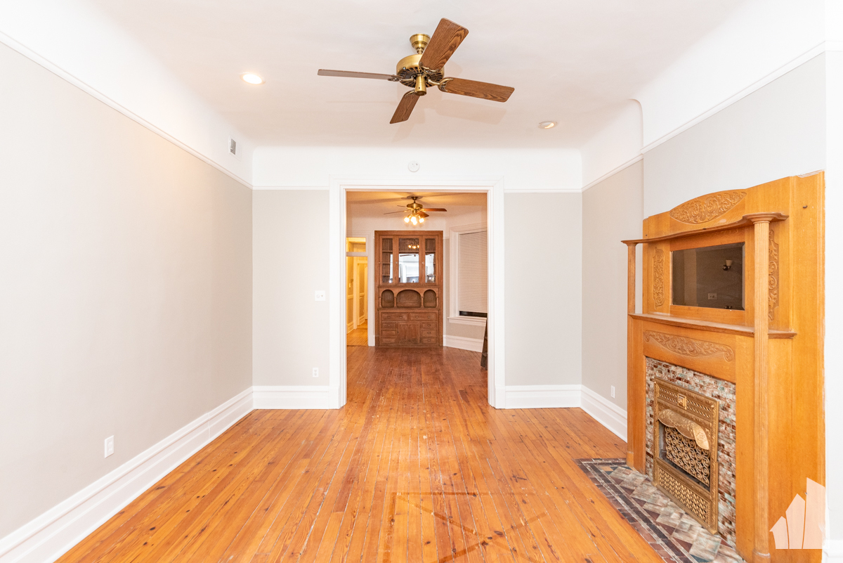 1420 West Irving Park Road, Unit 3 Chicago, IL 60613 - Photo 10 of 21 a view of a hallway with a chandelier