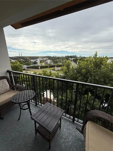 a living room with table table tennis pool table and chairs