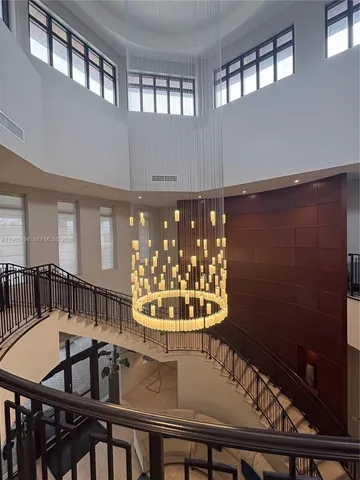 a view of a living room with furniture and wooden floor