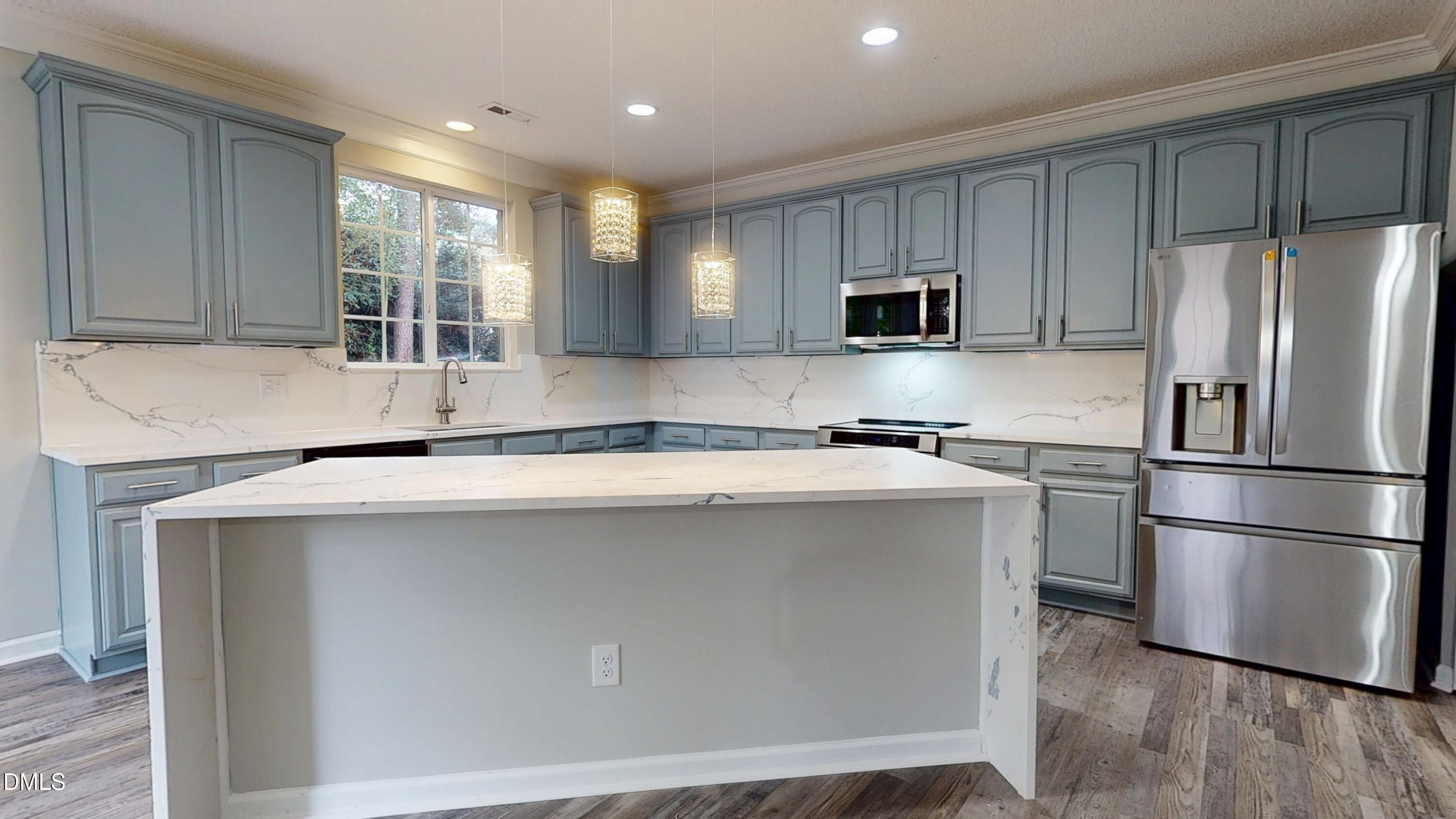 5708 Sea Fox Court Raleigh, NC 27616 - Photo 11 of 50 a kitchen with stainless steel appliances granite countertop a refrigerator and a sink