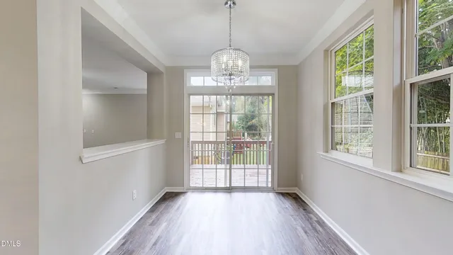 a kitchen with stainless steel appliances white cabinets and a stove
