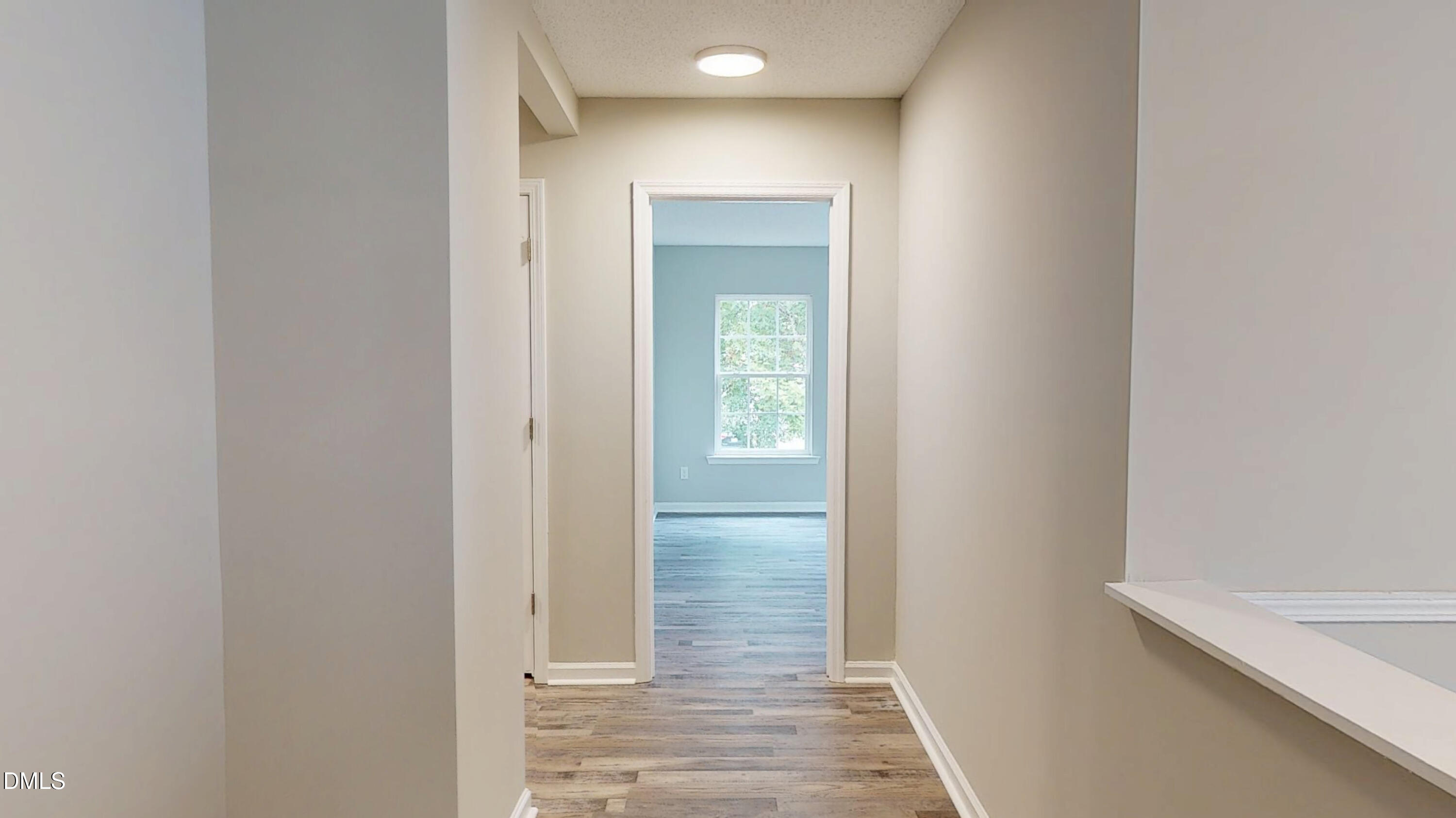 5708 Sea Fox Court Raleigh, NC 27616 - Photo 23 of 50 a view of hallway with wooden floor