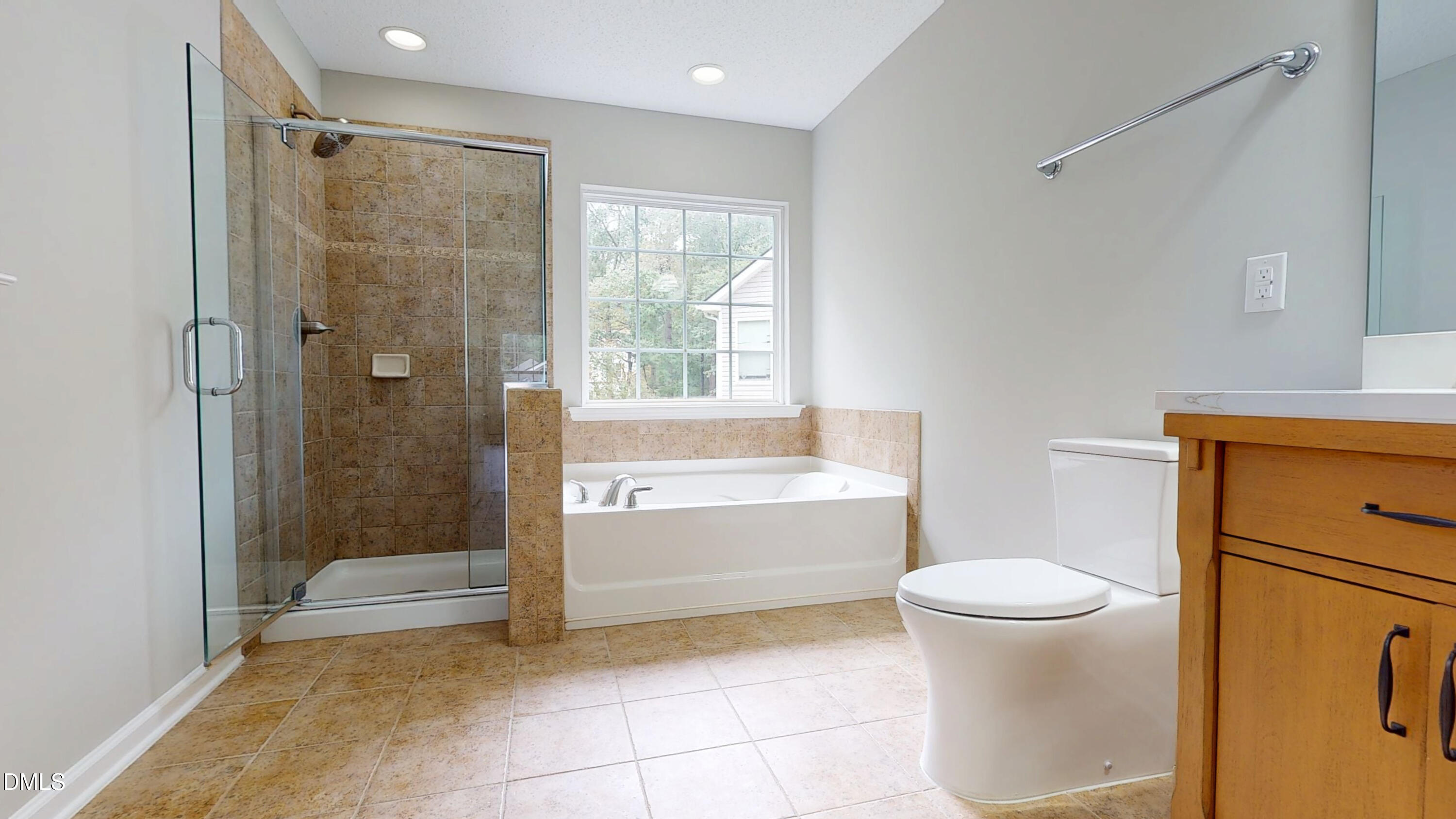 5708 Sea Fox Court Raleigh, NC 27616 - Photo 29 of 50 a bathroom with a granite countertop sink a toilet and shower