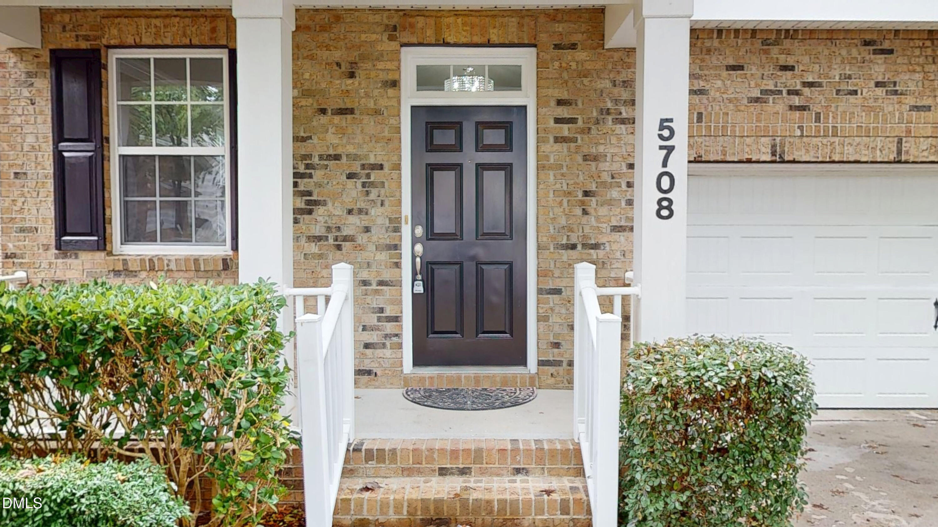 5708 Sea Fox Court Raleigh, NC 27616 - Photo 2 of 50 front view of a brick house with a small yard