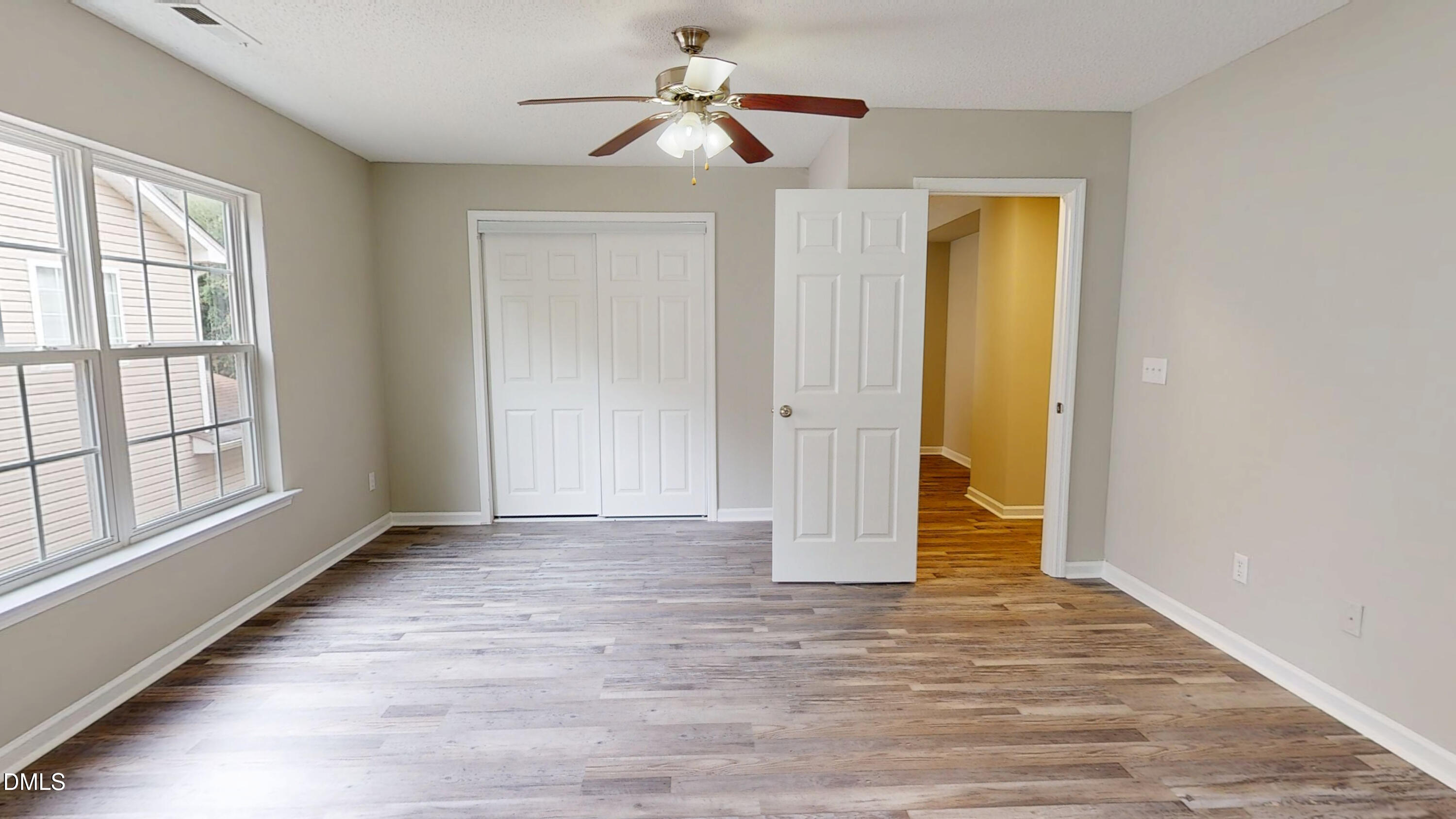 5708 Sea Fox Court Raleigh, NC 27616 - Photo 36 of 50 wooden floor in an empty room with a window
