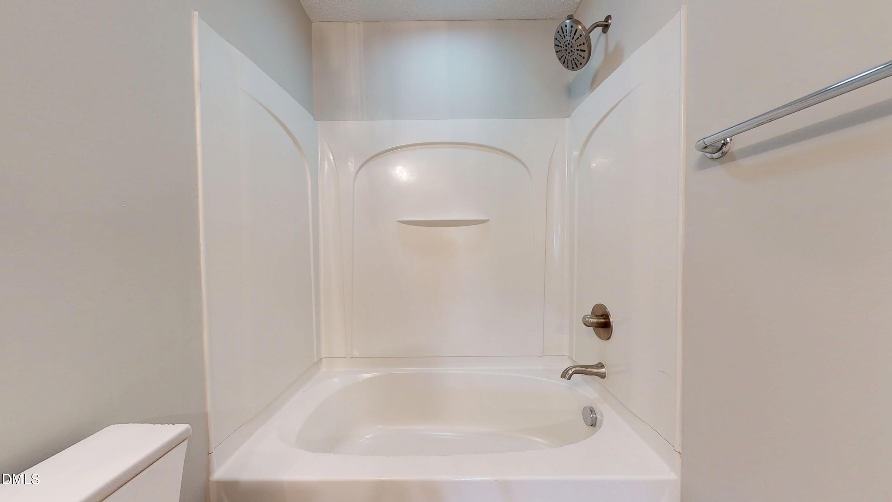 5708 Sea Fox Court Raleigh, NC 27616 - Photo 39 of 50 a white bath tub sitting next to a white toilet