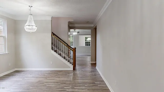 front view of a brick house with a small yard