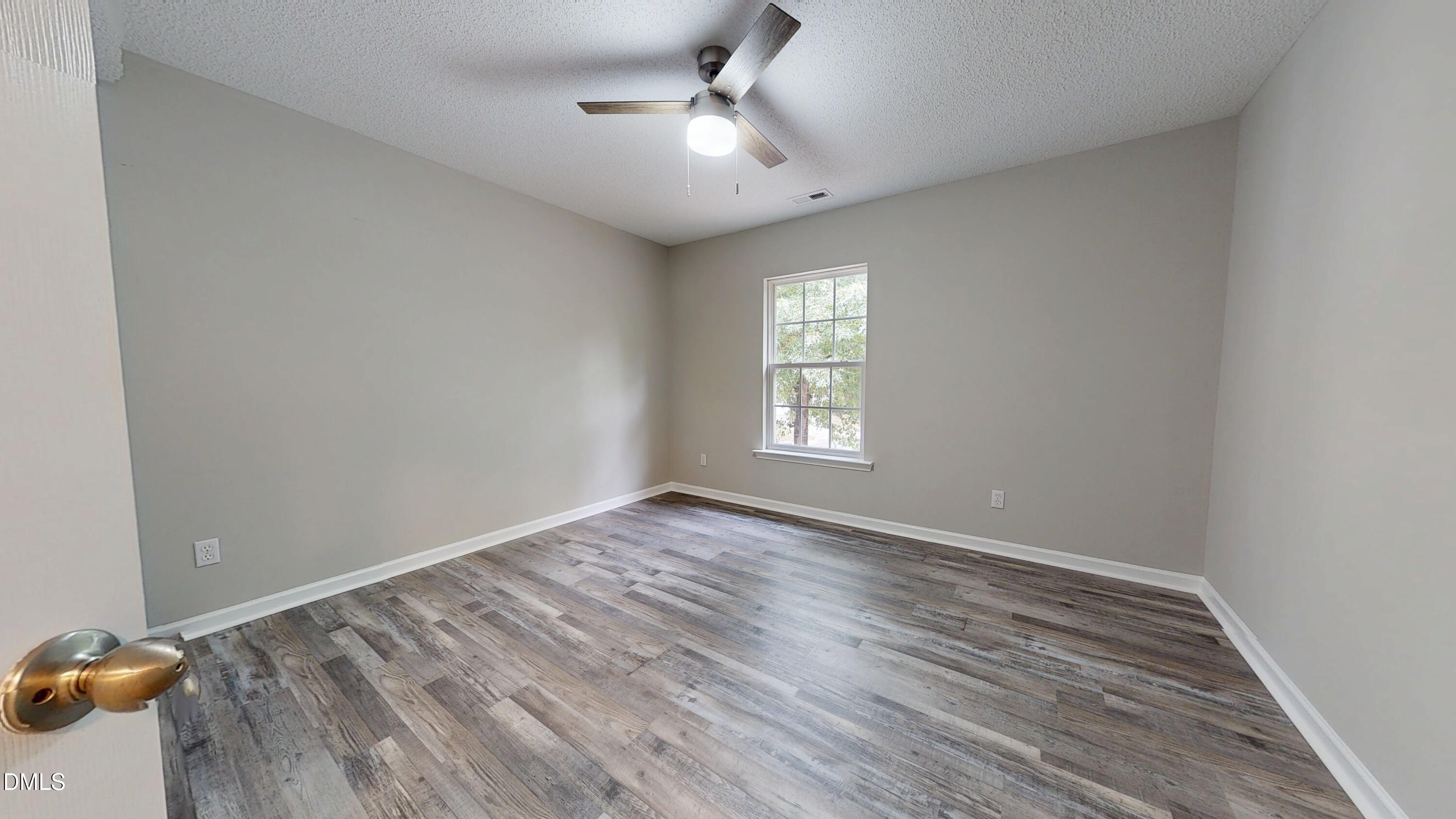 5708 Sea Fox Court Raleigh, NC 27616 - Photo 40 of 50 wooden floor in an empty room with a window