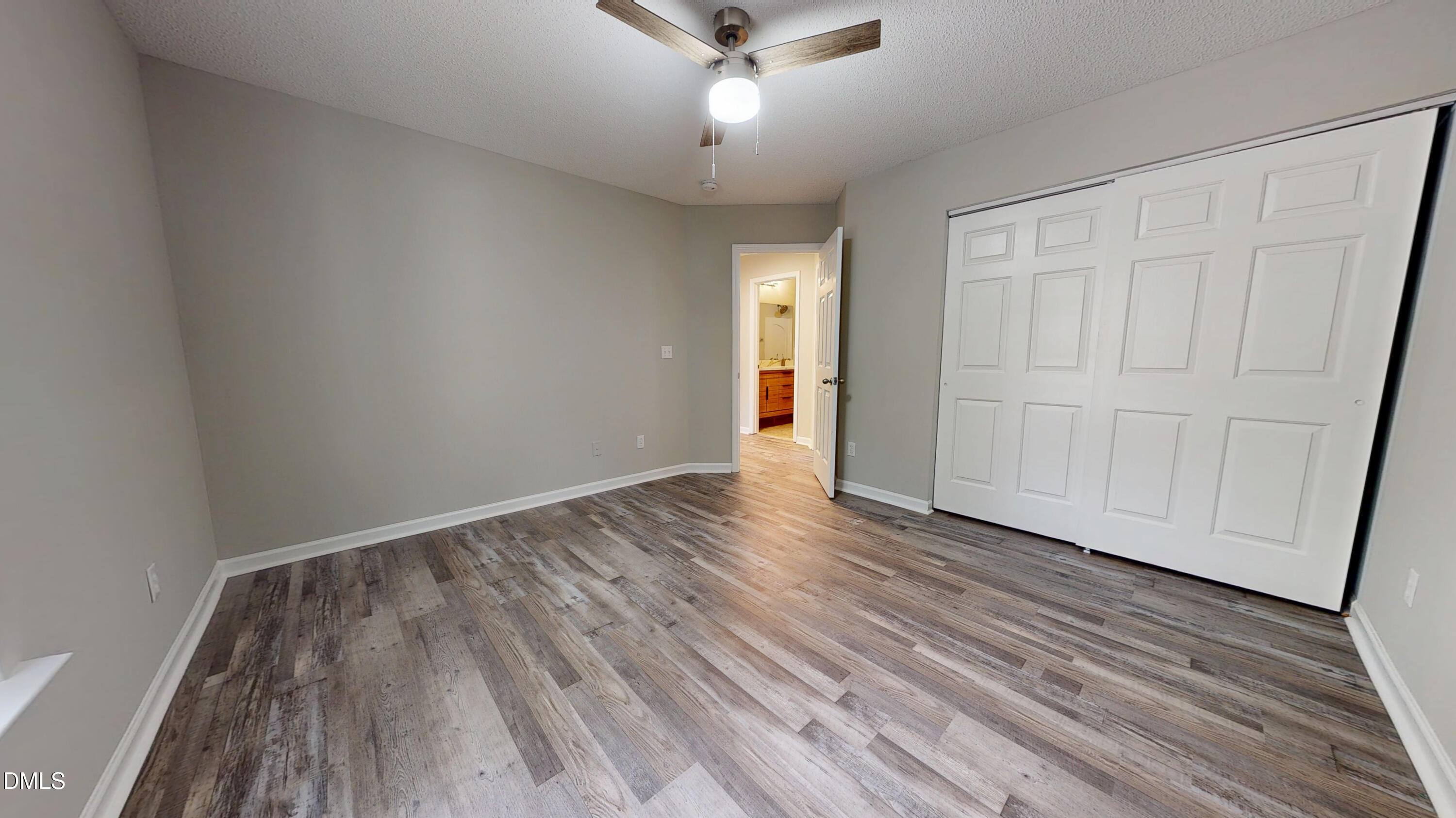 5708 Sea Fox Court Raleigh, NC 27616 - Photo 41 of 50 wooden floor in an empty room with a window