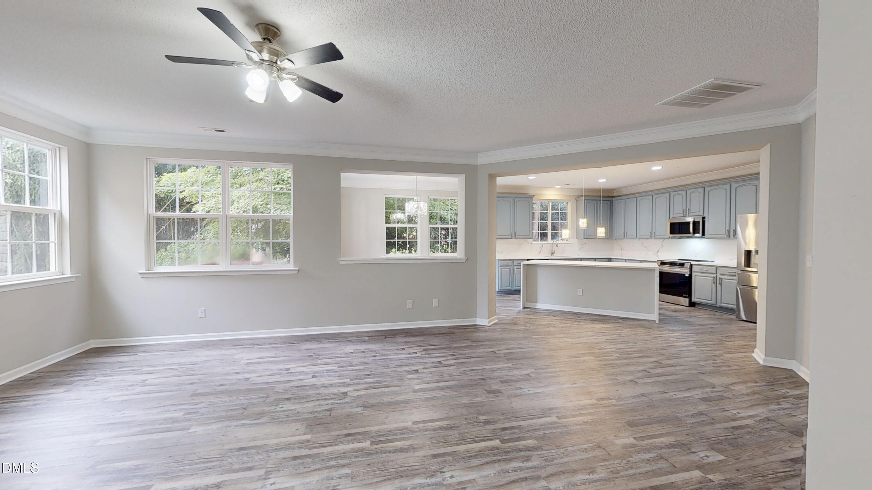5708 Sea Fox Court Raleigh, NC 27616 - Photo 9 of 50 a view of kitchen with stove and cabinets