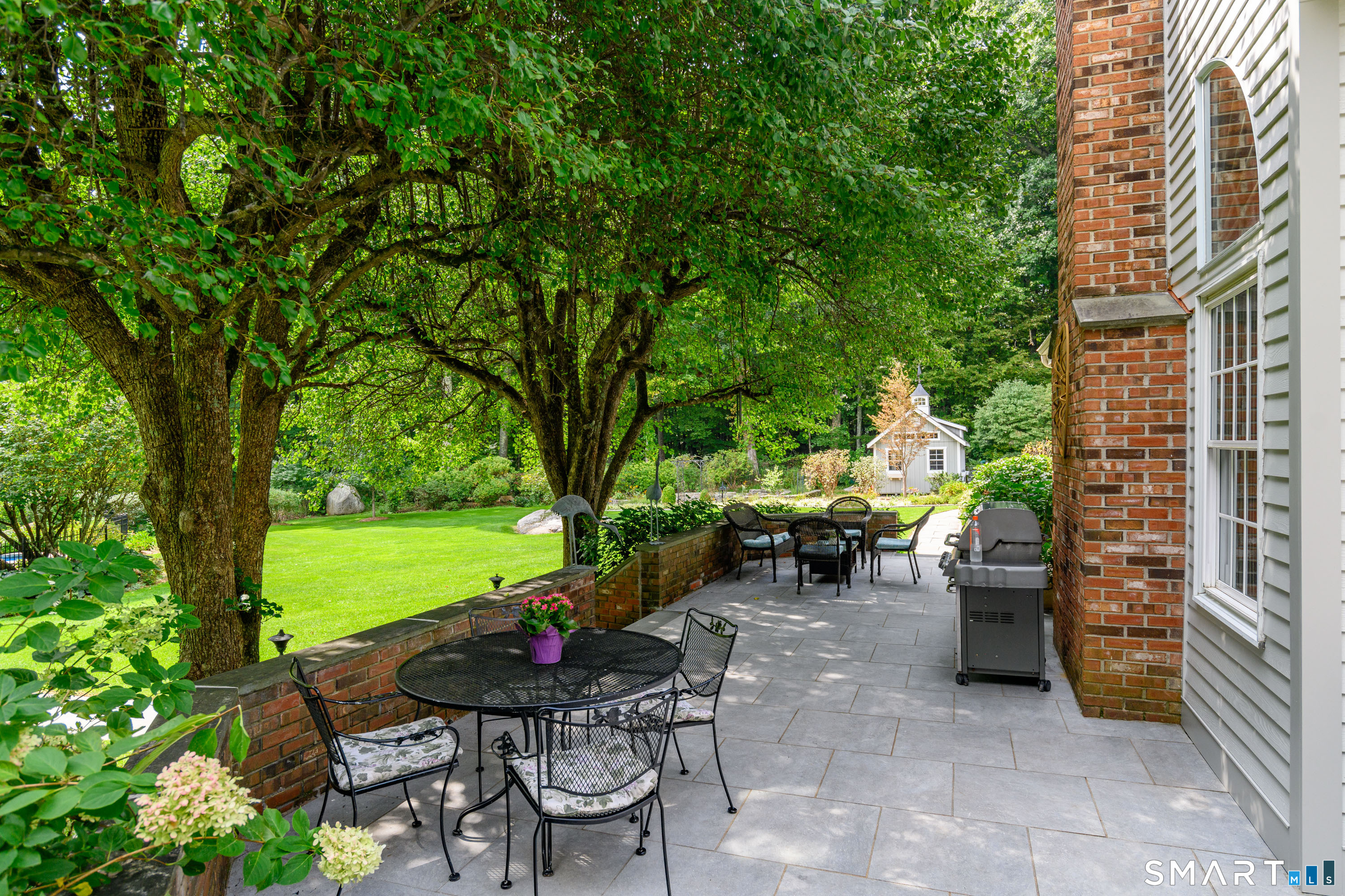 16 Winding Brook Road Newtown, CT 06470 - Photo 32 of 39 Expansive outdoor patio offering multiple areas for dining, grilling and entertaining.
