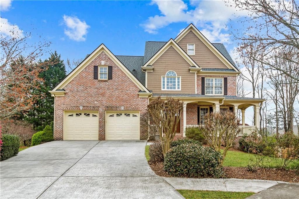 1732 Sweet Branch Trail Grayson, GA 30017 - Photo 1 of 1 a front view of a house with a yard and garage