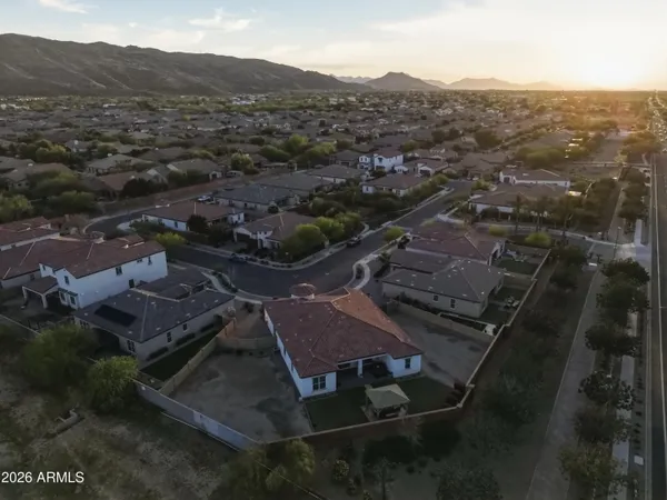 an aerial view of residential houses with city view