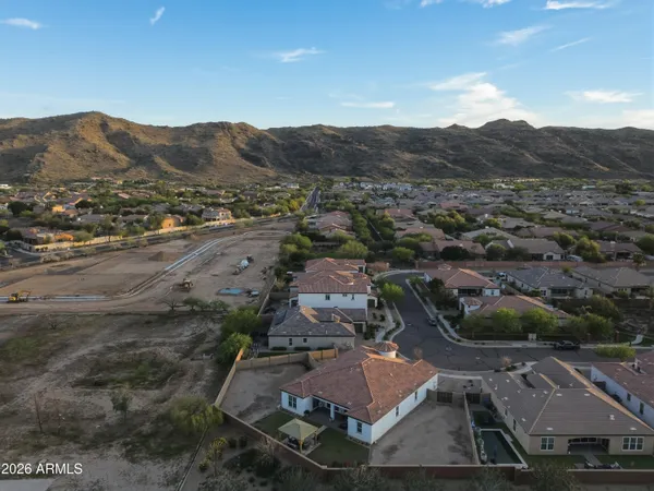 an aerial view of residential house and sandy dunes