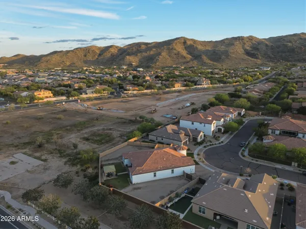 an aerial view of residential house and sandy dunes