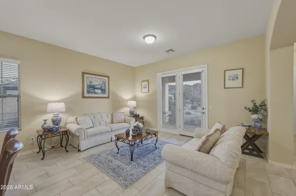 a living room with furniture and a large window