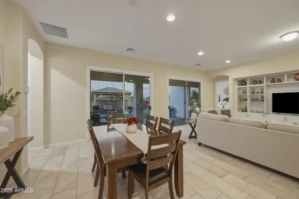 a view of a dining room with furniture and window