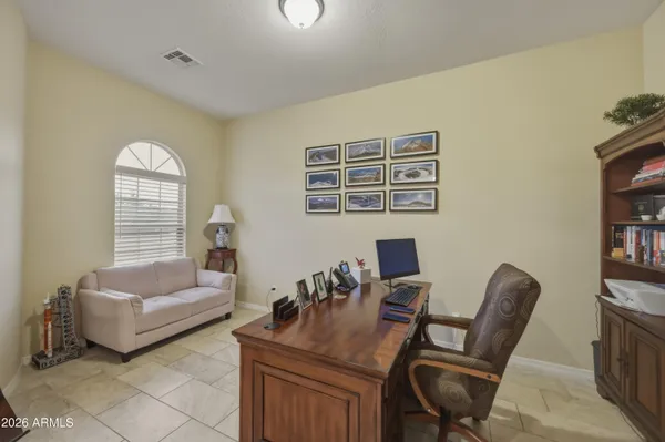 a work room with furniture and a window
