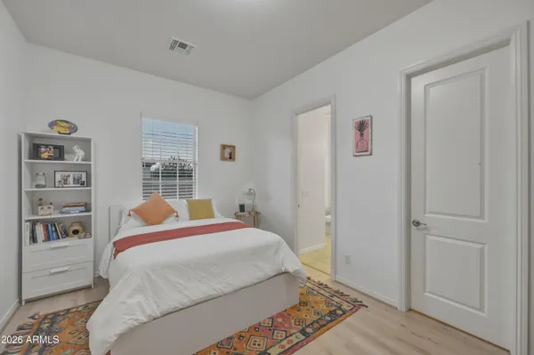 a bedroom with a bed and a closet