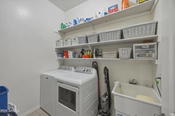 a view of a garden with lawn chairs