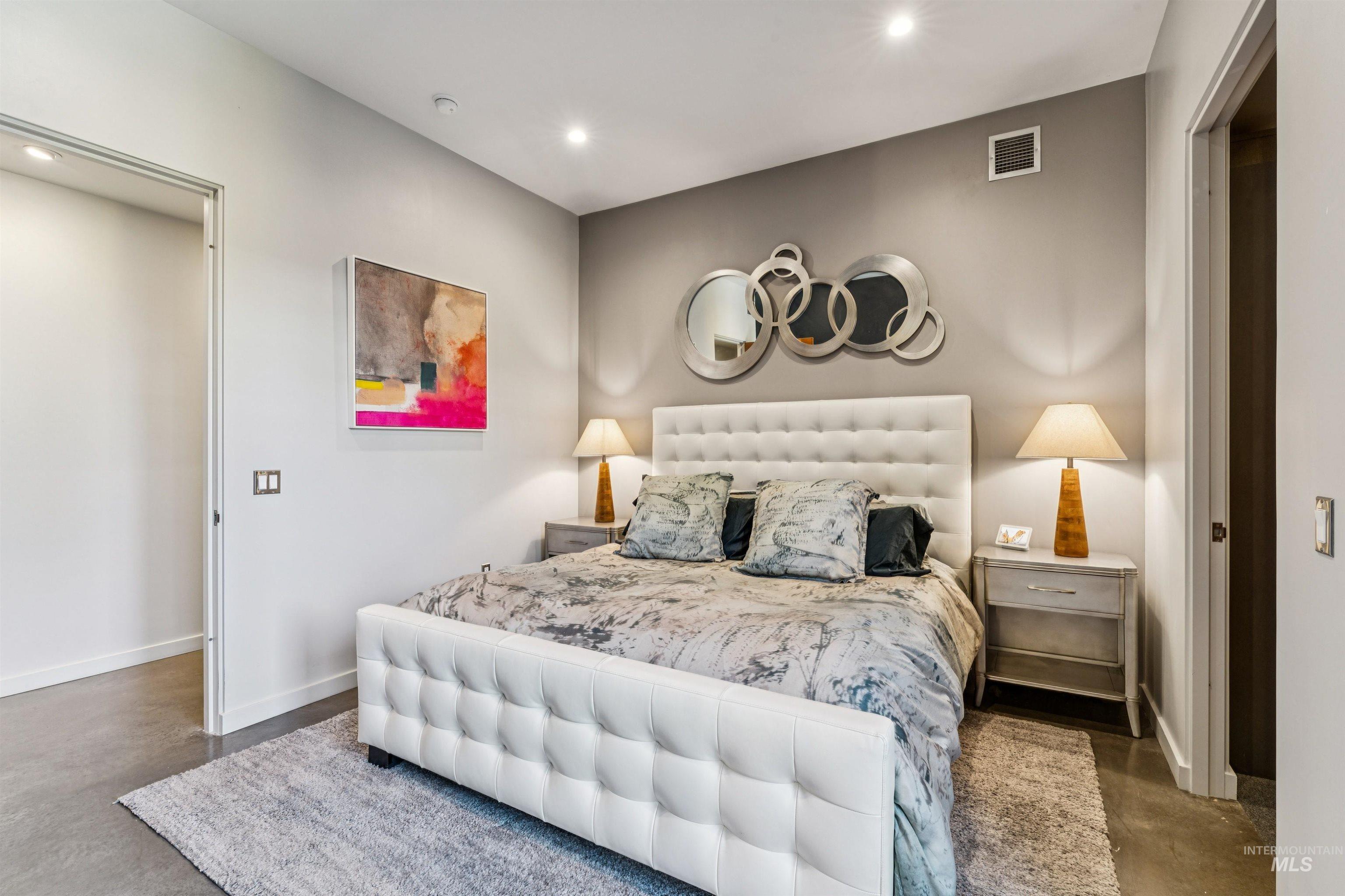 119 South 10th Street, Unit 307 Boise, ID 83702 - Photo 20 of 47 Bedroom featuring a white upholstered platform bed, recessed lighting, and polished concrete flooring