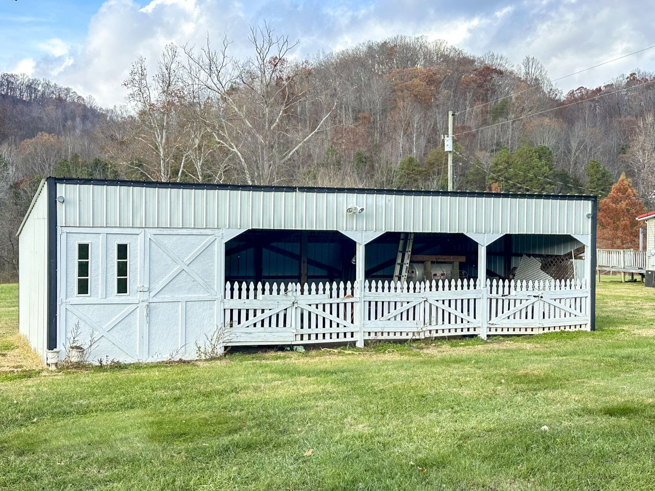 2641 Stanley Valley Road Surgoinsville, TN 37873 - Photo 6 of 26 a view of a house with a small yard and fence
