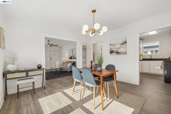 a kitchen with stainless steel appliances a sink stove and microwave