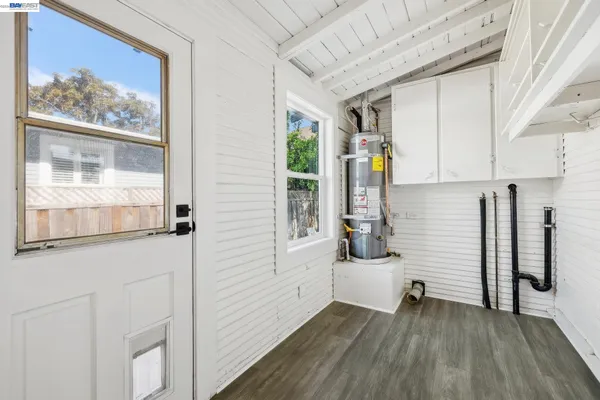 a view of backyard with deck and outdoor seating