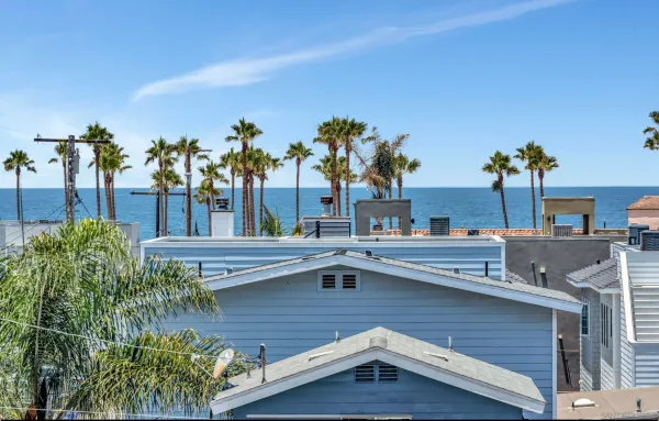 a view of a house with pool and chairs