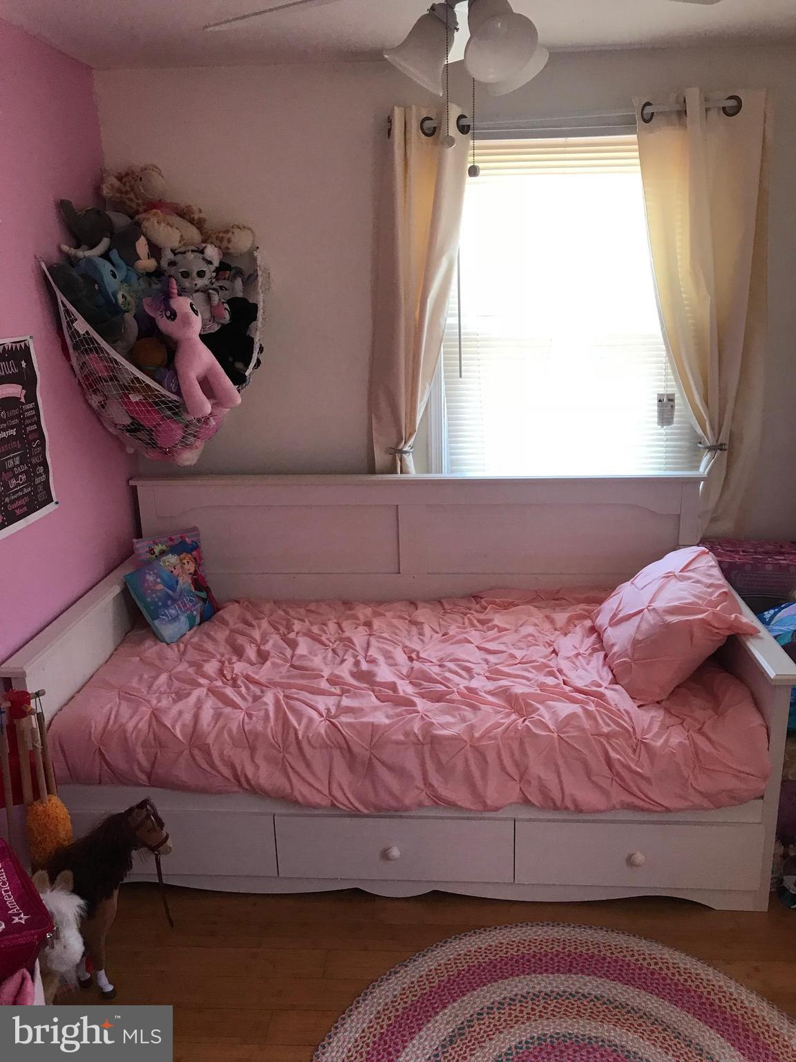 8180 Del Haven Road Baltimore, MD 21222 - Photo 13 of 29 a bedroom with a bed and a window