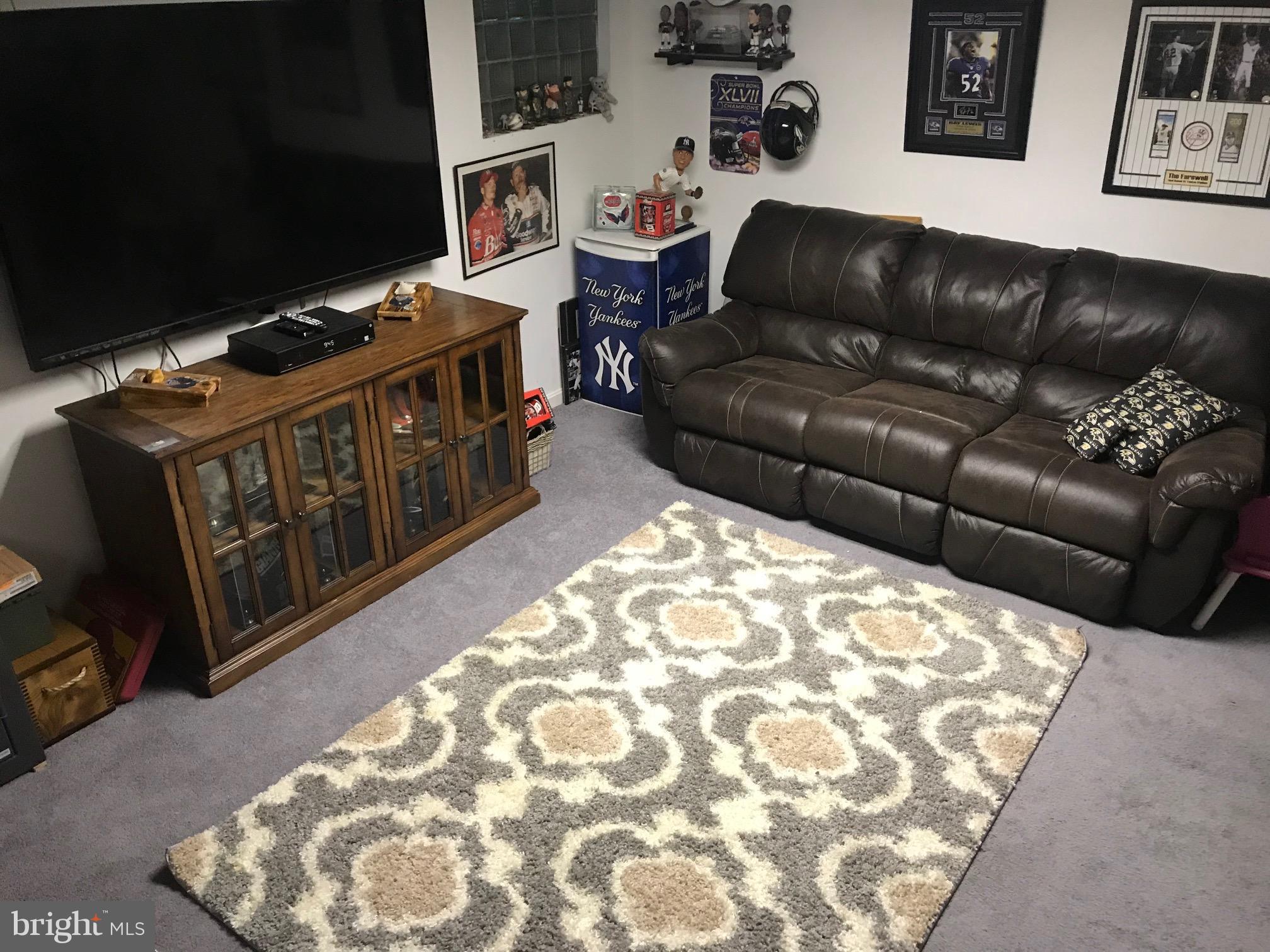 8180 Del Haven Road Baltimore, MD 21222 - Photo 20 of 29 a living room with a couch and a stove