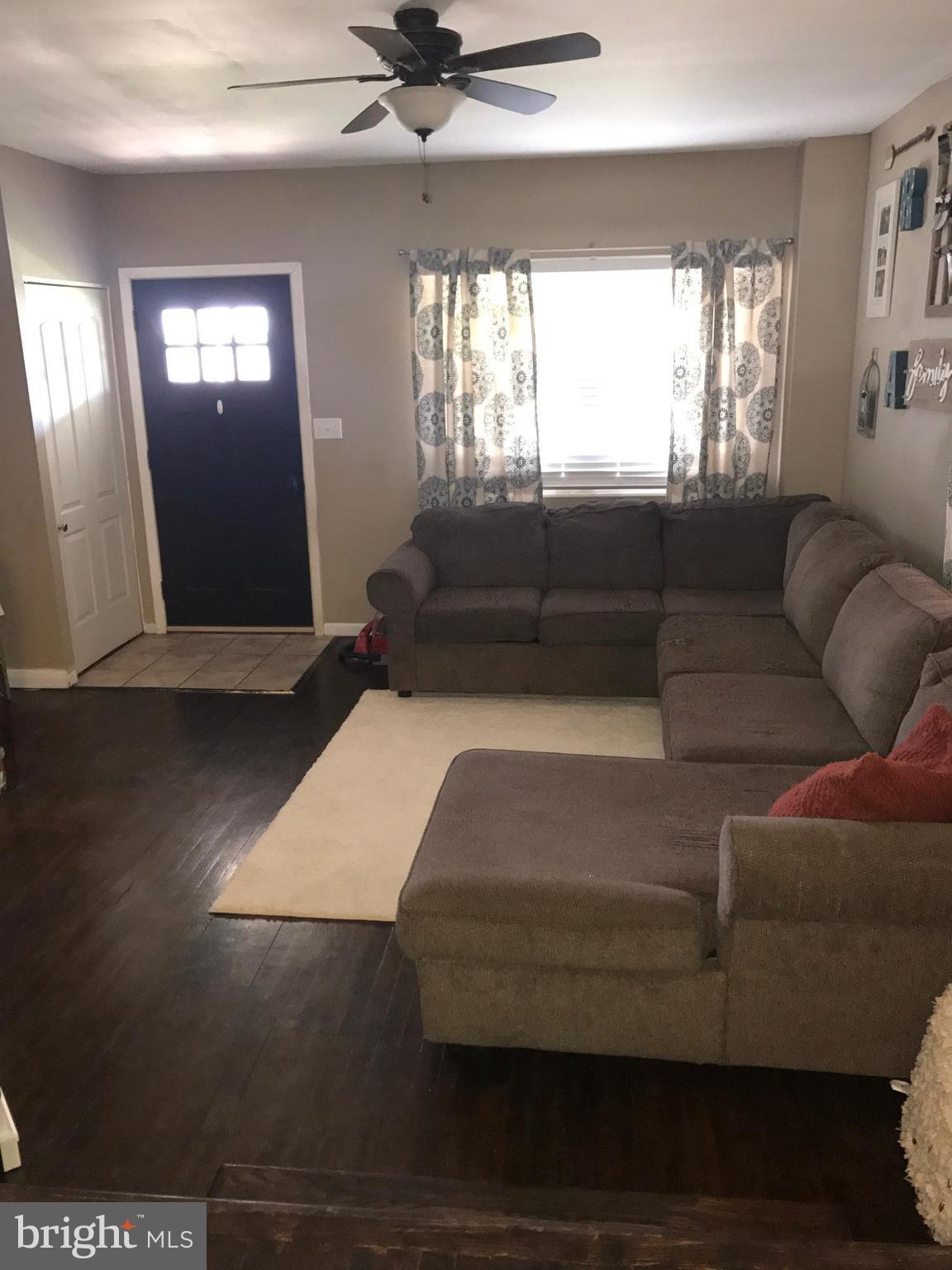 8180 Del Haven Road Baltimore, MD 21222 - Photo 3 of 29 a living room with furniture and window