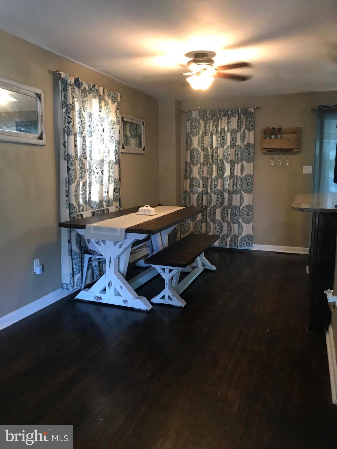 8180 Del Haven Road Baltimore, MD 21222 - Photo 8 of 29 a dining room with furniture and window