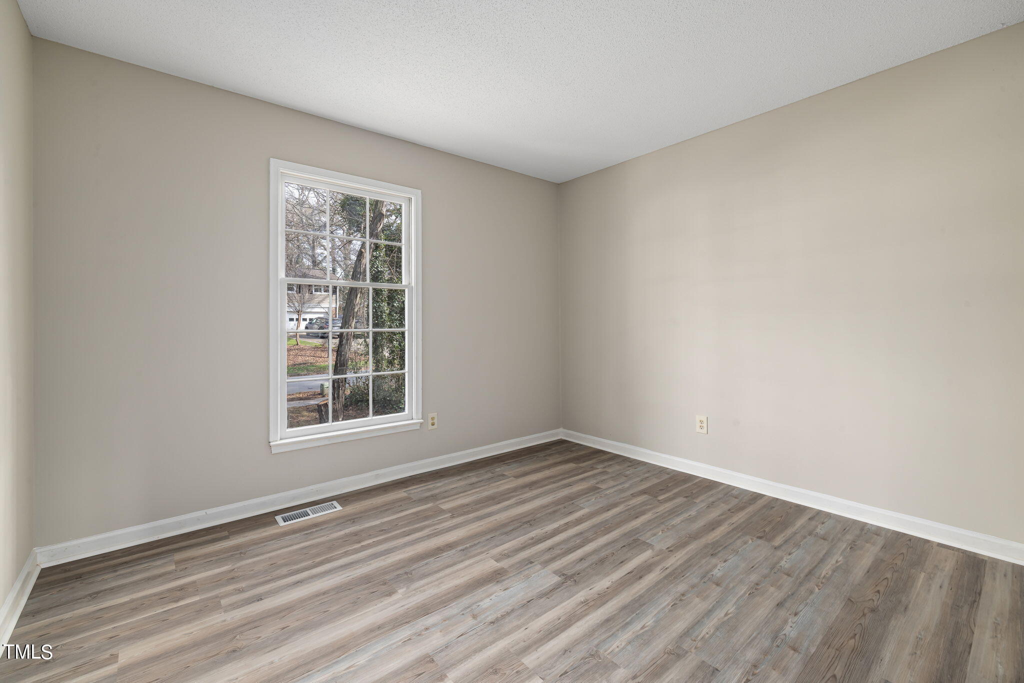 608 Old Farm Road Raleigh, NC 27606 - Photo 19 of 32 wooden floor in an empty room with a window