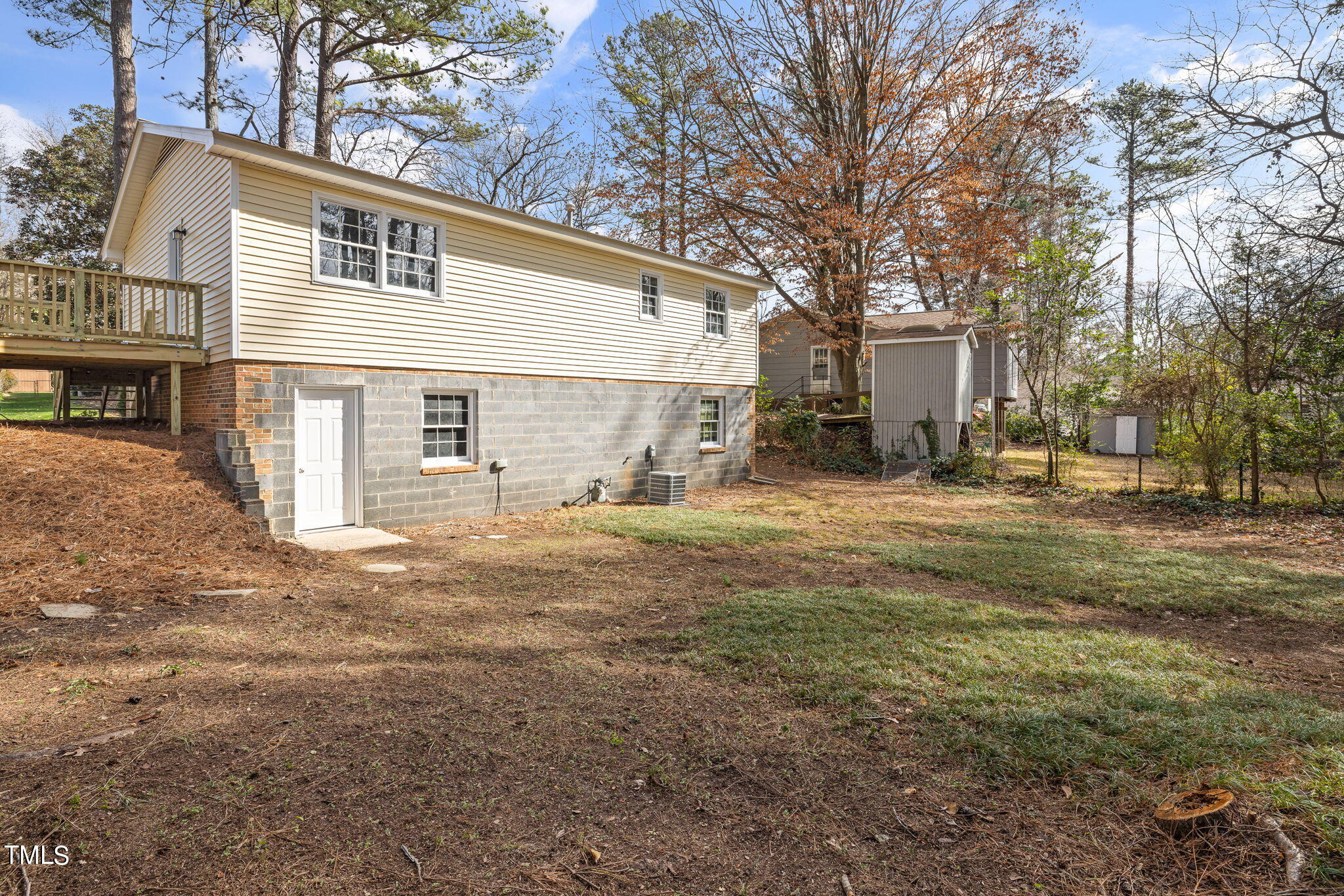 608 Old Farm Road Raleigh, NC 27606 - Photo 30 of 32 a view of a house with backyard and trees