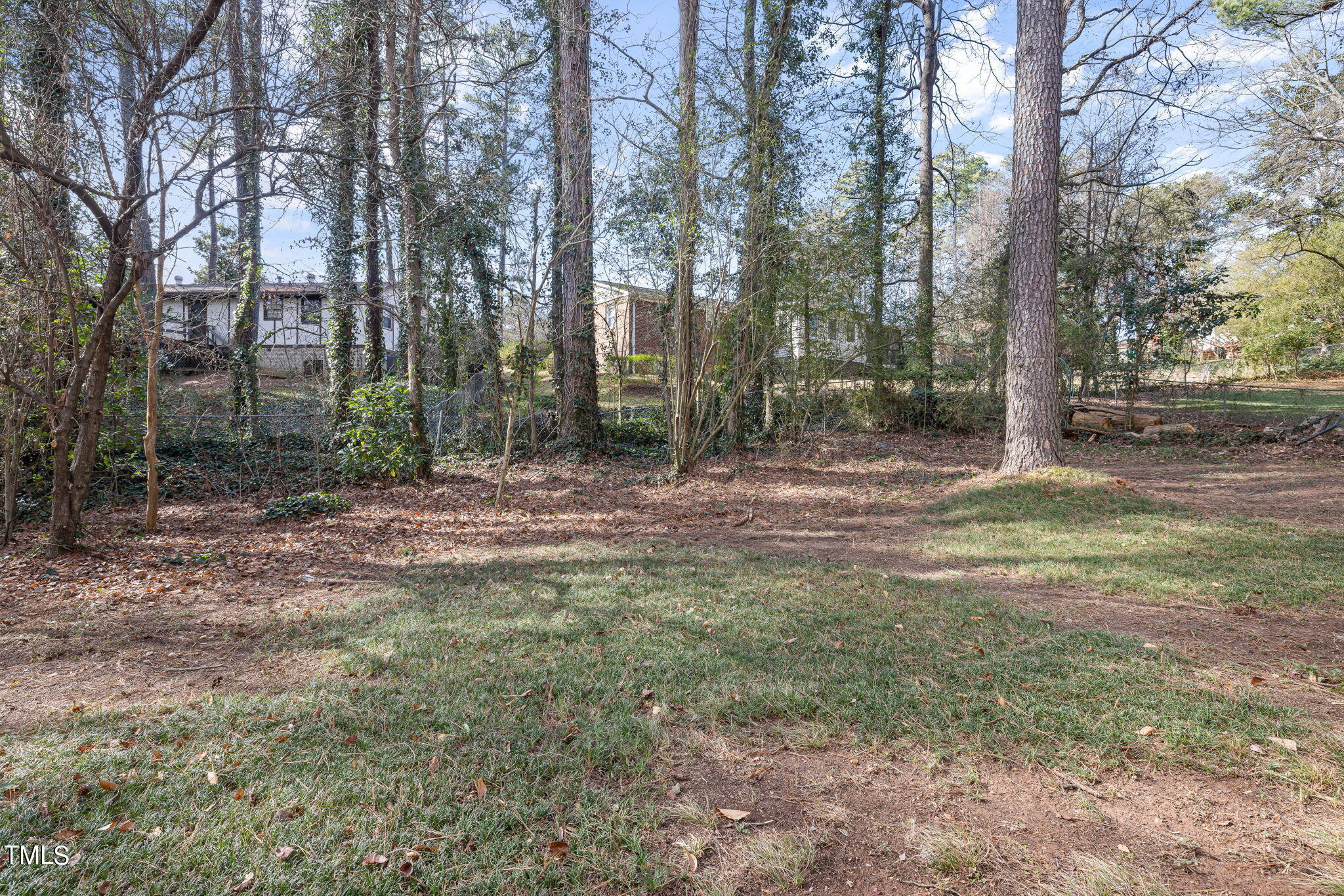 608 Old Farm Road Raleigh, NC 27606 - Photo 31 of 32 a backyard of a house with lots of green space