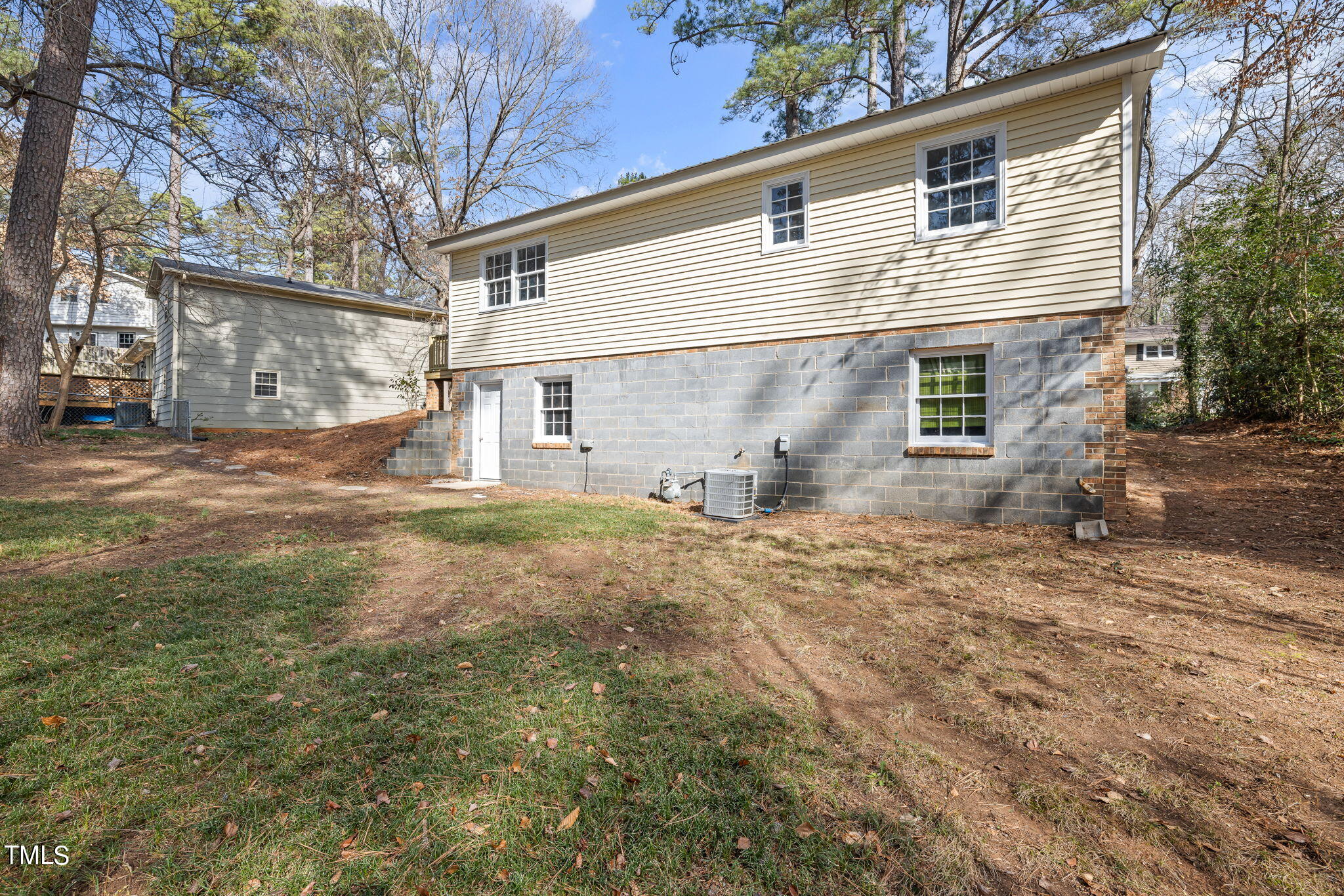 608 Old Farm Road Raleigh, NC 27606 - Photo 32 of 32 a view of a house with backyard and a tree