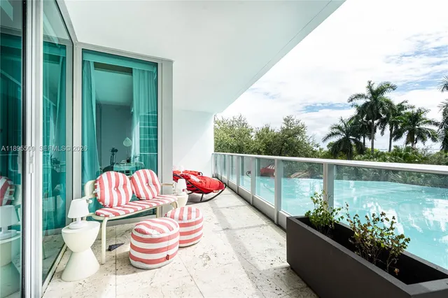 a view of a chair and table in the balcony