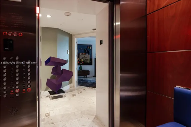 a kitchen with a refrigerator and mirror