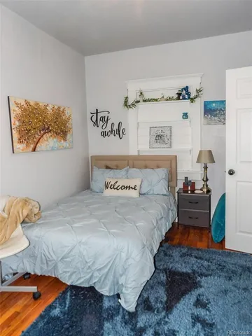 a bedroom with a bed and a couch