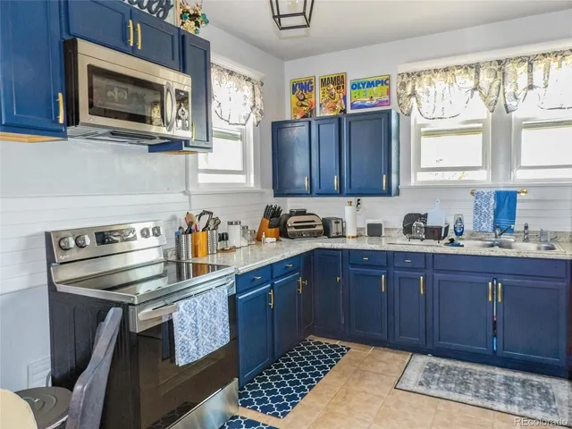 a kitchen with a cabinets and appliances