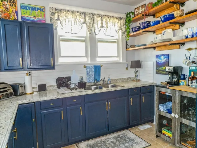 a kitchen with stainless steel appliances granite countertop wooden cabinets a sink and dishwasher